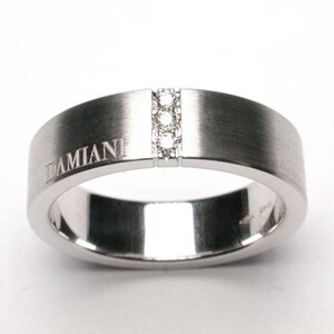Anello Damiani a fascia in oro e brillanti Anello Damiani a fascia in oro e brillanti