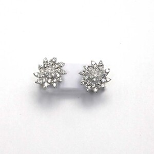 Orecchini Fiore di Loto in oro bianco e Diamanti Damiani Orecchini Fiore di Loto in oro bianco e Diamanti Damiani